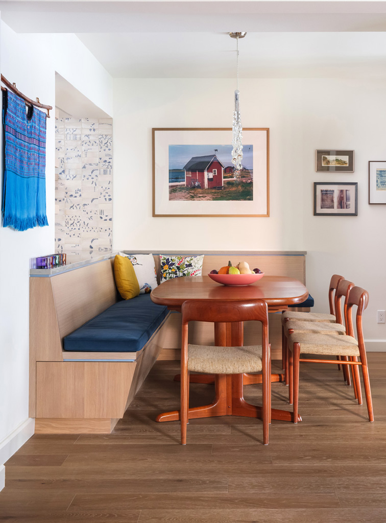 Custom dining nook – Custom wood dining nook with banquette seating in a Central West End remodel by Hercules Design Build, an architect remodeling St. Louis expert.