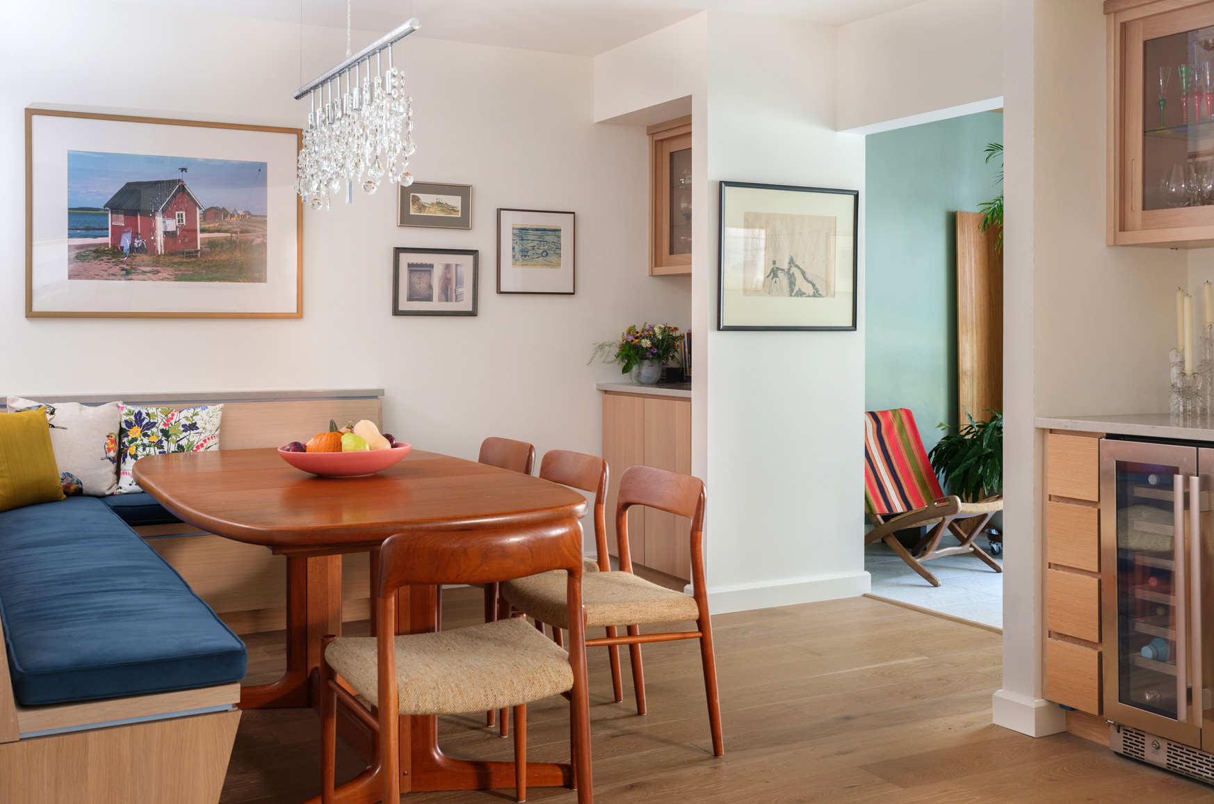 Dining area with view to sunroom – Open dining area connecting to plant-filled sunroom in a Central West End remodel by Hercules Design Build, a st louis design remodeling expert.